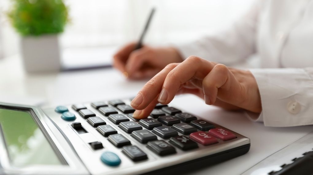 person with calculator