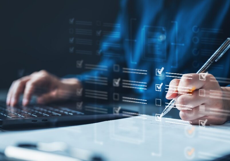 Professional completing a digital checklist
